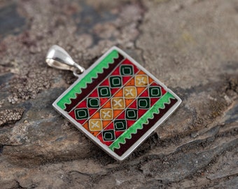 Georgian cloisonné enamel pendant, unique Georgian ornaments in green and red, Caucasus culture.