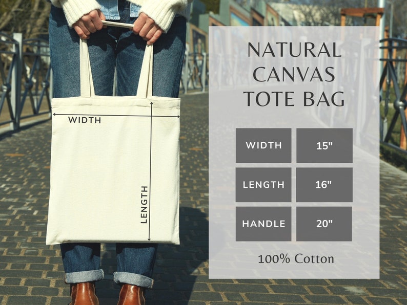 May include: A natural canvas tote bag with a white background and black text. The bag is 15 inches wide, 16 inches long, and has a 20 inch handle. It is made of 100% cotton.