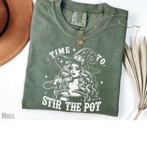 Halloween pun shirt with diva witch stirring a pot with the words time to stir the pot