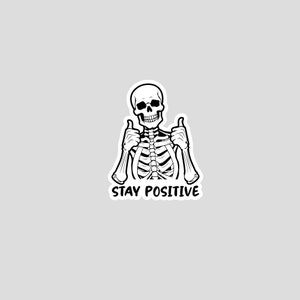 Sticker graphic of skeleton giving two thumbs up with the words stay positive