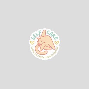 funny self care sticker with cat preening and words self care looks different for everyone