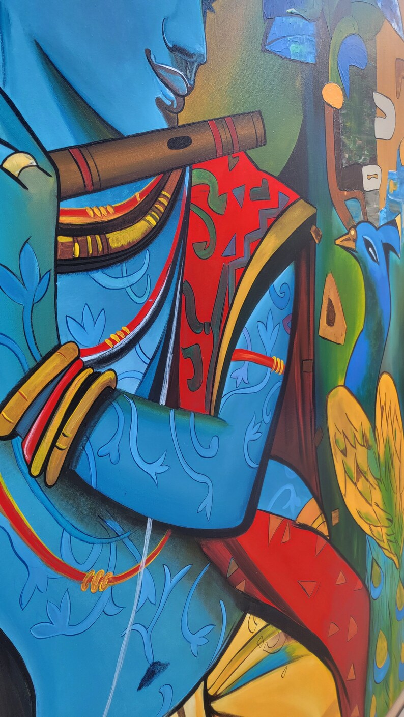 May include: A painting of a blue figure playing a flute, with a peacock in the background. The figure is wearing a red and gold patterned garment and has a blue and gold patterned sleeve. The peacock is blue and green with yellow feathers.