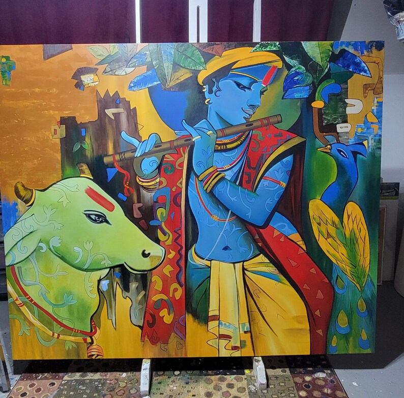May include: A colorful painting depicting a blue-skinned figure playing a flute, with a green cow and a peacock in the background. The figure is adorned with jewelry and a yellow headdress. The painting is done in a vibrant style with bold colors and intricate details.