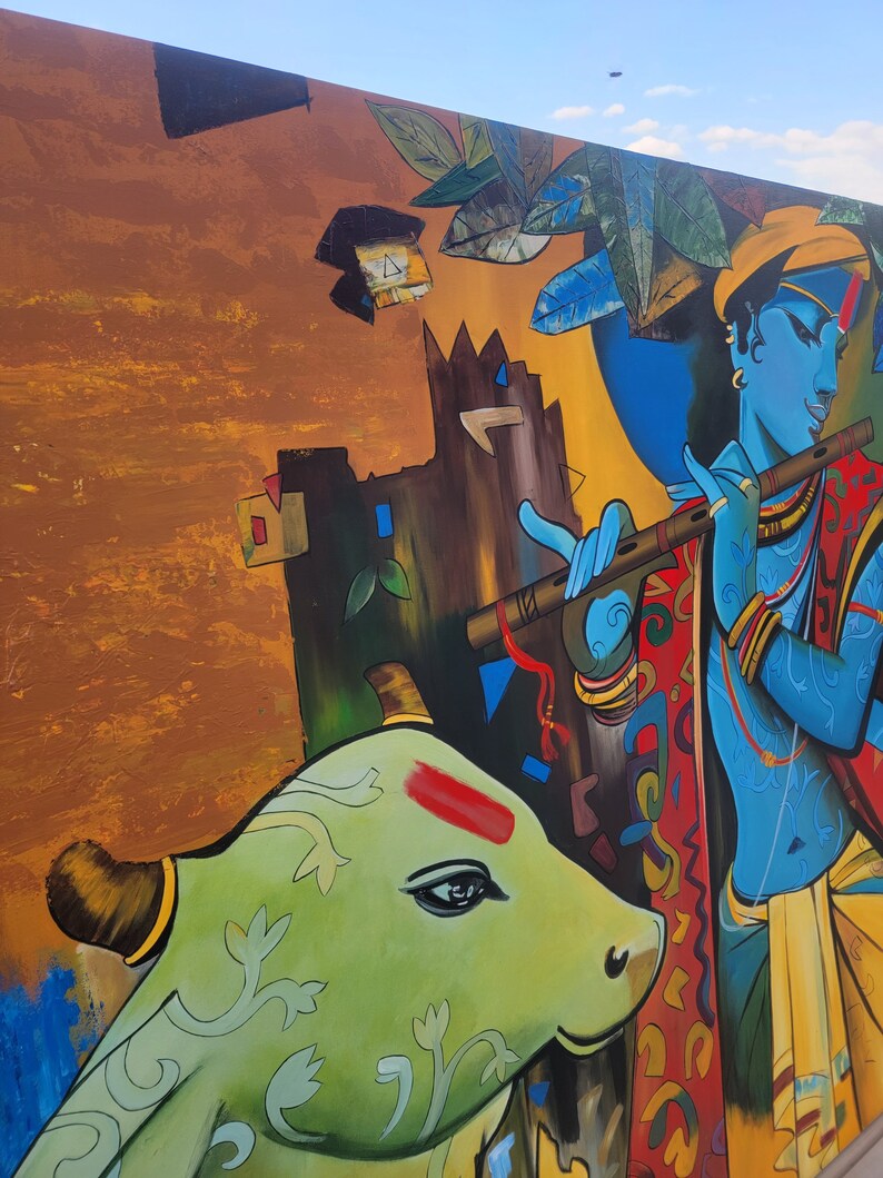 May include: A colorful painting depicting a blue figure playing a flute, with a green cow in the foreground. The background features a yellow and brown abstract design.