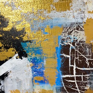 May include: Abstract painting featuring gold, white, blue and black paint. The paint is applied in thick layers, giving it a textured appearance.