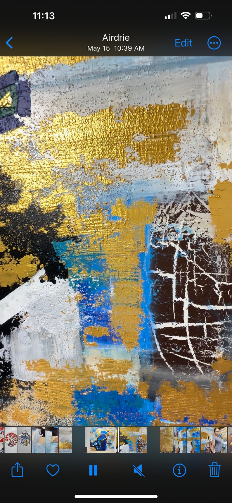 May include: Abstract painting featuring gold, white, blue and black paint. The paint is applied in thick layers, giving it a textured appearance.