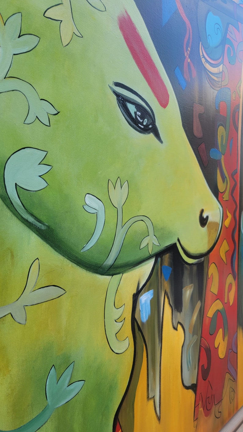 May include: A close-up of a green and yellow abstract painting with a stylized cow's head and floral designs. The cow's eye is black and the background is a mix of red, yellow, and blue.