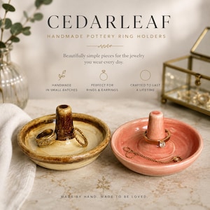 May include: Two circular ceramic ring holders with central cones. One is a mottled brown and cream glaze holding two gold rings. The other is a solid soft pink glaze holding a gold ring and a delicate gold chain. Text reads CEDARLEAF.