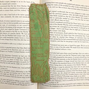 May include: A green bookmark with a fairy illustration and a quote: "Come away, O human child. To the waters and the wild. With a faery, hand in hand. For the world's more full of weeping than you can understand."