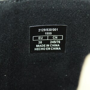 May include: A black label with white text that reads "2129/8330/0001 1555 EU 38 CN 245/76 MADE IN CHINA HECHO EN CHINA"