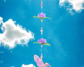 Radiant Handcrafted Purple Iridescent Hummingbird Suncatcher with Glass Beads and Floral Accents