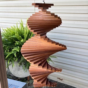 4.05 16 x 8"  Mahogany Wind Spinner  adds a "Touch of Class" to any space.