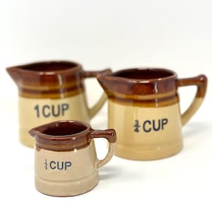 Vintage farmhouse ceramic crock pitcher measuring cup set: 1, 3/4, and 1/4 cups
