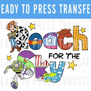 May include: A colorful iron-on transfer design featuring Woody and Buzz Lightyear from Toy Story. The design says "Reach for the Sky" with each letter made up of different images from the movie.