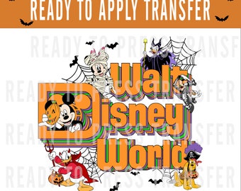 May include: Halloween themed iron-on transfer featuring Mickey Mouse, Donald Duck, Goofy, and other Disney characters in front of a retro "Walt Disney World" logo with spiderwebs and bats.