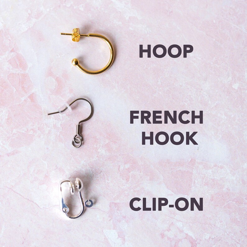 May include: Three different types of earring findings: a gold hoop, a silver french hook, and a silver clip-on.