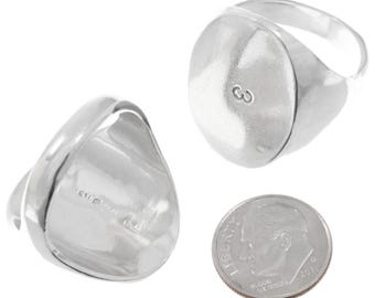 May include: A set of two silver signet rings. One ring features a smooth, oval face with the letter "G" engraved. The other ring is shown from the side, displaying the band and the back of the oval face. A dime is included for size reference.
