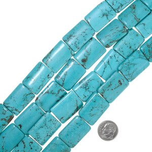 May include: A strand of turquoise gemstone beads, each bead is rectangular and has a light blue colour with dark blue veining. The beads are arranged in a staggered pattern, with the top row of beads slightly offset from the bottom row. A UK ten pence coin is included for scale.