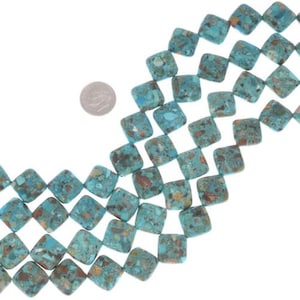 May include: Strands of square turquoise beads with brown and green inclusions. The beads are arranged in rows, with a dime for size comparison. These beads are ideal for jewelry making.