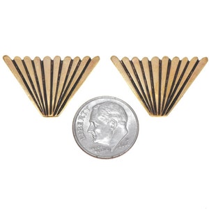 May include: A pair of gold-tone metal earrings with a fan-shaped design. The earrings are about the size of a dime.