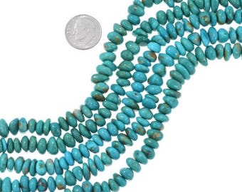 May include: Strands of turquoise-colored gemstone beads. The beads are oval-shaped and vary in size. A US dime is included for size reference. The beads have a natural, earthy appearance, with variations in color and texture.