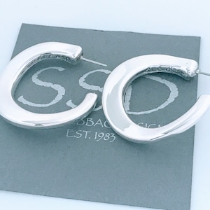 May include: A handmade wooden sign with the text "Welcome" in a playful font. The sign features a distressed white background and a dark brown border, perfect for a front door or entryway. The sign measures approximately 12 inches wide and 6 inches tall.