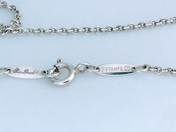 Estate Tiffany & Co. SS Coin Edge Dogtag Pendant | Walter Bauman Jewelers