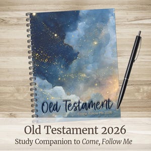 May include: A spiral-bound notebook featuring a blue and gold celestial watercolor design. The cover displays "Old Testament" and "Come, Follow Me 2026." A black pen lies next to the notebook on a wooden surface. It is a study companion.