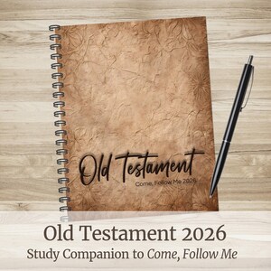 May include: A spiral-bound notebook with a textured, sepia-toned cover featuring the words "Old Testament" in elegant script. A black pen rests beside the notebook. The text "Come, Follow Me 2026" and "Study Companion to Come, Follow Me" are also visible.