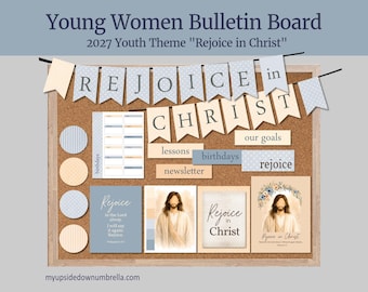 May include: A cork bulletin board featuring a banner with the text Rejoice in Christ, along with various printed cards, circular cutouts, and labels labeled lessons, birthdays, our goals, and newsletter, all centered around the 2027 youth theme.