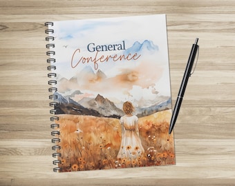 May include: Spiral-bound notebook with a watercolor illustration. The cover features the text "General Conference" above a scenic landscape with a woman in a field. A black pen rests on the right side of the notebook.