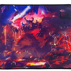 May include: Rectangular mousepad featuring a fantasy battle scene with a winged demon wielding a glowing sword. The artwork is dominated by red, blue, and purple hues, with a black border.