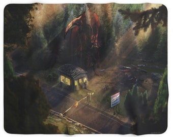 May include: A blanket featuring a fantasy scene with a red dragon looming over a small building and a road. The artwork depicts a forest setting with a sign that reads "BORDER PATROL STATION". The blanket is a soft, cozy item.