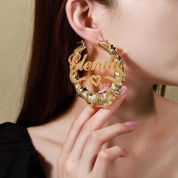 ピアス JIL SANDER  Small Bamboo hoop earrings Bamboo hoop earrings in gold - Jil Sander | Mytheresa