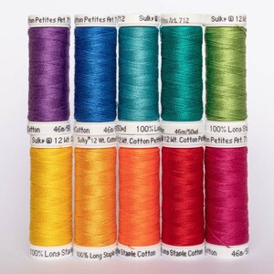 May include: A rainbow assortment of 10 spools of 100% long staple cotton thread. The spools are labeled "Sulky" and "Petites Art." The thread colors are purple, blue, teal, green, yellow, orange, red, and pink.