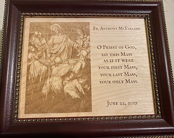 May include: A framed wooden plaque with a laser-engraved image of the Last Supper and a poem about a priest. The text reads: "Fr. Anthony McFarland O Priest of God, Say this Mass as if it were your first Mass, your last Mass, your only Mass. June 22, 2019"