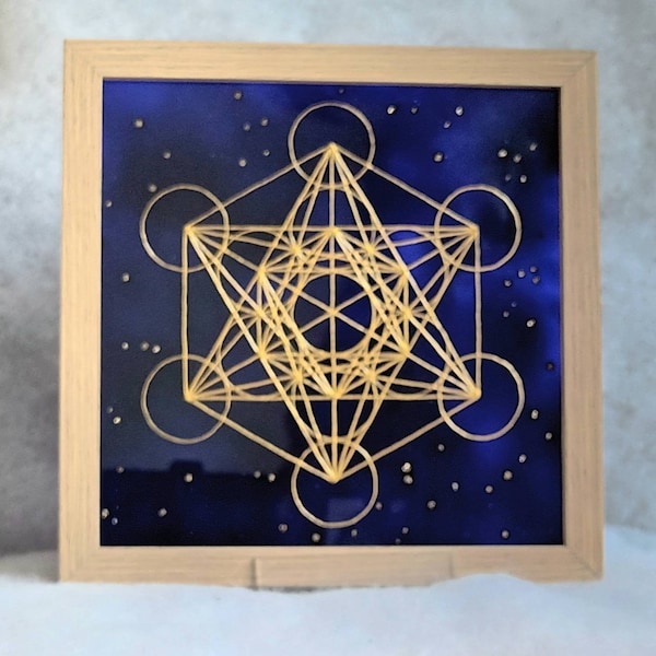 Cube de Metatron doré sur fond de galaxie tableau à poser pour laisser traverser la Lumière