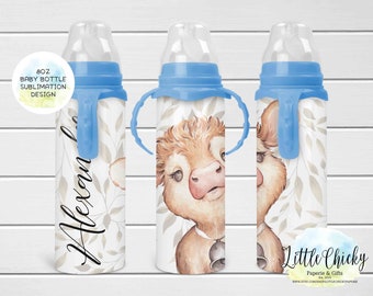 May include: 8 oz baby bottle sublimation design featuring a watercolour illustration of a brown and white cow with blue bell accents. The bottle has a blue handle and a clear nipple. The design includes a leafy pattern and the text "Little Chickie Paperie & Gifts"