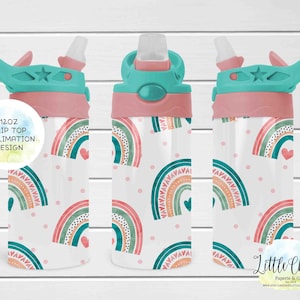 May include: A 12oz flip-top water bottle with a sublimation design. The bottle features a repeating pattern of colorful rainbows, hearts, and polka dots on a white background. The lid is pink and teal.