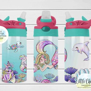 May include: Three 12oz flip top water bottles with sublimation designs. The bottles are turquoise and pink with a mermaid, a dolphin, and a turtle design. The bottles are on a white wood background.