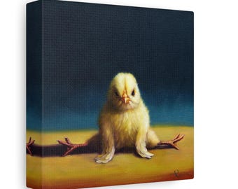 May include: A yellow baby chick with its legs spread out in a funny pose. The chick is sitting on a yellow surface with a dark blue background.