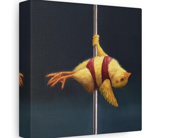 May include: A canvas print featuring a whimsical illustration of a yellow bird wearing a red and white striped band, hanging from a silver pole. The bird is positioned at an angle against a dark blue background.