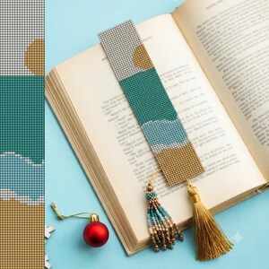 May include: A rectangular beaded bookmark featuring a landscape pattern with a gold sun, teal sky, light blue clouds, and a tan base. The bookmark includes a multi-colored beaded fringe and a long gold tassel attached to the bottom edge.