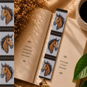 May include: A rectangular beaded bookmark featuring a repeating pattern of brown horse heads on a white background, separated by horizontal black and brown stripes, with a small metallic horse charm attached to the bottom edge.