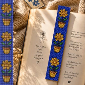 May include: A rectangular beaded bookmark featuring a repeating pattern of three yellow flowers in brown pots against a deep blue background, placed inside an open book with printed text that reads Take your time. Grow at your own pace.