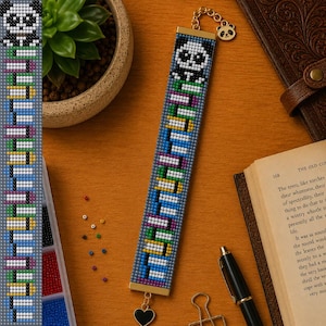May include: A rectangular beaded bookmark featuring a pixelated panda face at the top and a repeating pattern of colorful books in shades of blue, yellow, green, and purple on a grey background, finished with a gold-tone metal panda charm.