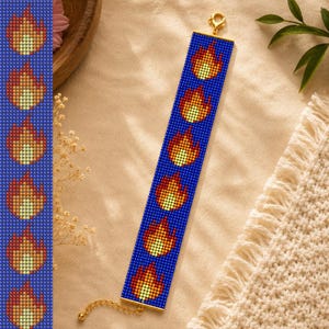 May include: A rectangular beaded bracelet featuring a repeating pattern of flame icons in yellow, orange, and red against a deep blue background. The bracelet is finished with gold-toned metal end bars and a matching gold-toned lobster claw clasp.