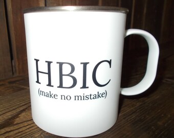 May include: White ceramic mug with a black inscription that reads "HBIC (make no mistake)"