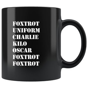 May include: Black ceramic coffee mug with white text that reads "FOXTROT UNIFORM CHARLIE KILO OSCAR FOXTROT FOXTROT".
