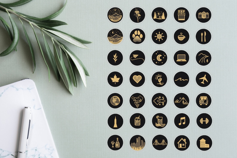 May include: A set of 36 black and gold Instagram highlight covers with various icons, including mountains, a paw print, a sun, a coffee cup, a fork and knife, a leaf, a paper airplane, a crescent moon, a laptop, a road, a maple leaf, a heart, a cactus, a wave, an airplane, a globe, a mountain range, a star, a van, a skyscraper, a mason jar, a glass of lemonade, a music note, a dumbbell, a champagne flute, a cityscape, a bridge, a house, and a building.